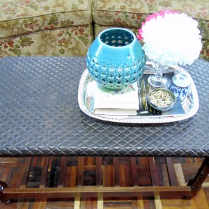 Finished table with quilted leather top