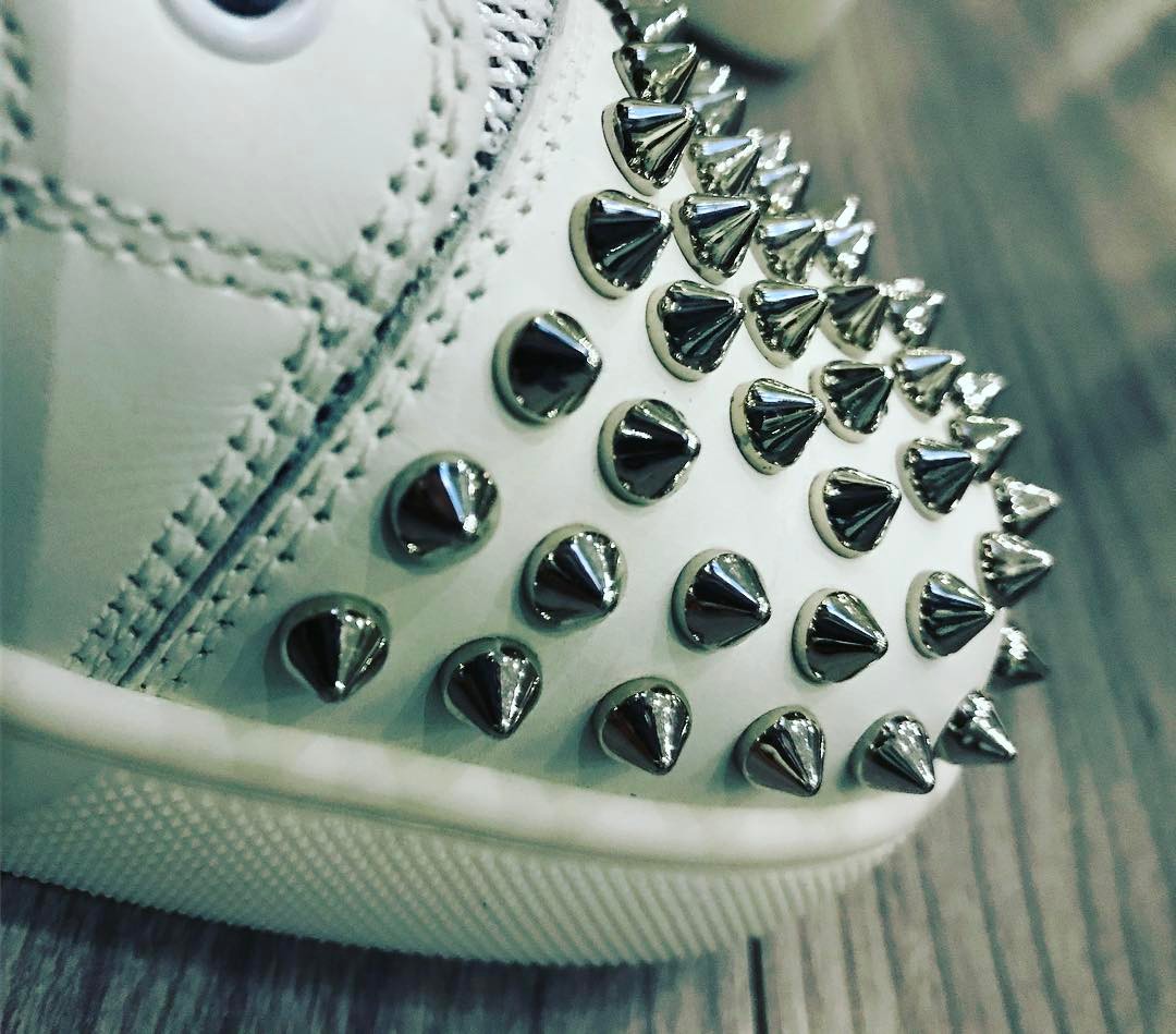 White sneakers with spikes