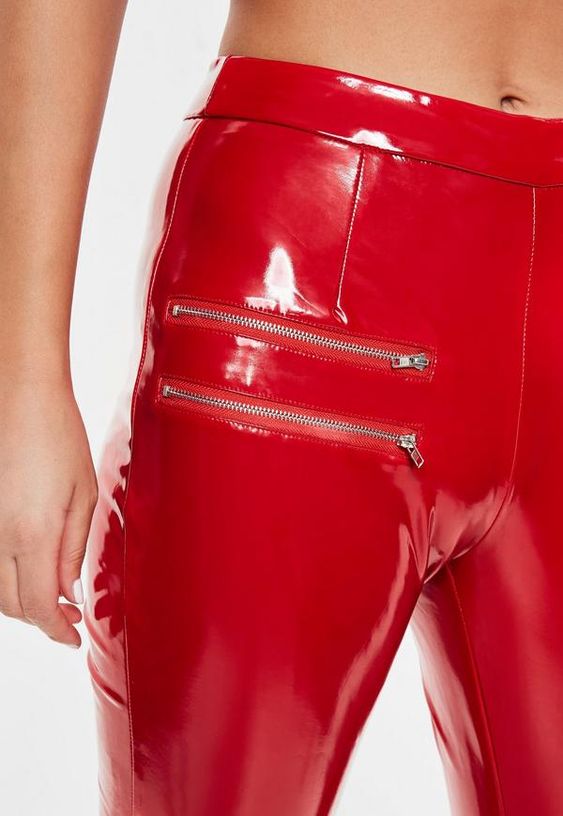 Red PVC pants with exposed zippers