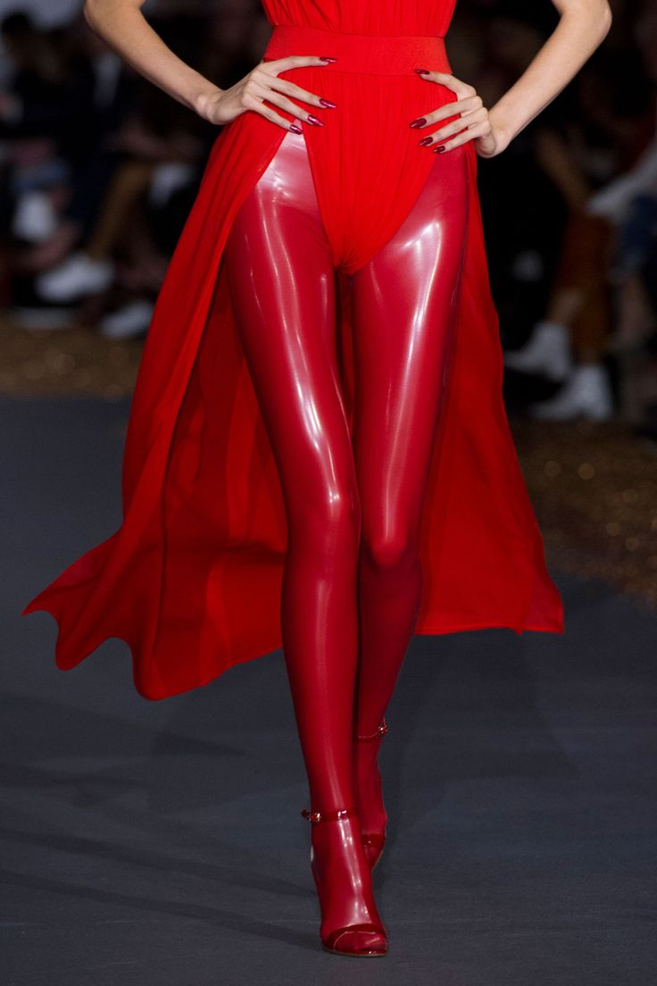 Red latex leggings underneath red dress