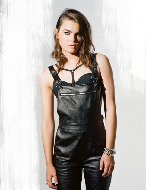 Black leather overalls with zipper at chest