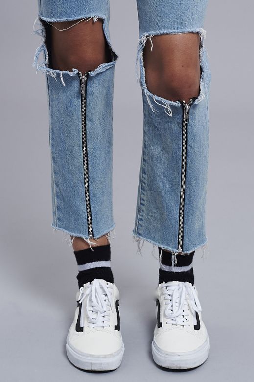 Distressed jeans with zippers