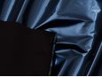 Black backing shown on top of metallic blue pvc vinyl material. thumbnail image.