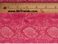 Macro shot of pink embossed vinyl snakeskin fabric. thumbnail image.