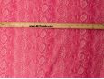 View of pink pleather snakeskin pattern against ruler. thumbnail image.