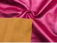 Back of the fabric shown on top of hot pink snakeskin fabric. thumbnail image.