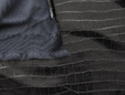 Black backing of stretchy vinyl snakeskin fabric. thumbnail image.