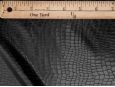 Stretch black snakeskin fabric. thumbnail image.