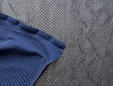 Backing color of silver-blue metallic stretch snakeskin fabric. thumbnail image.