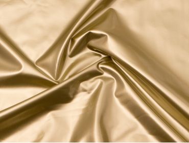 Metallic gold 4-way stretch vinyl fabric.