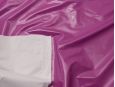 White backing shown on top of plum colored PVC vinyl fabric. thumbnail image.