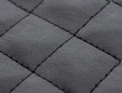 Closeup shot of quilted faux leather material. thumbnail image.