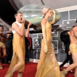 Transparent latex servanty carrying Lady Gaga.