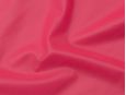 Semi-transparent hot pink thick latex sheeting.