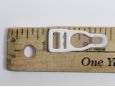 Length of 10mm wide white garter clip. thumbnail image.