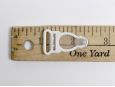 Length of 15mm wide white garter clip. thumbnail image.