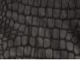 Faux black crocodile reptile print fabric. thumbnail image.