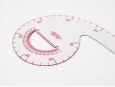 Round head with half circle inside it on french curve ruler. thumbnail image.