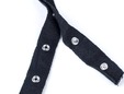 Closeup fo black snap tape for clothing and home decor. thumbnail image.