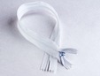 White invisible 18 inch nylon zipper. thumbnail image.