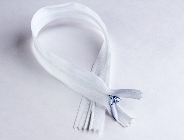 White invisible 18 inch nylon zipper.