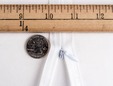 Macro shot of 36 inch white concealed nylon zipper. thumbnail image.