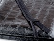 Black 12 inch invisible non-separating zipper shown on black crocodile fabric. thumbnail image.