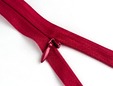Shot of zipper pull of blood red invisible zipper. thumbnail image.