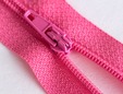Closeup of hot pink nylon teeth zipper. thumbnail image.