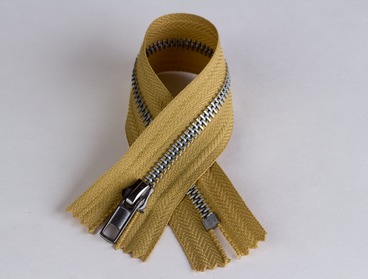 Gold hued aluminum zipper.