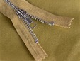 Gold hue zipper shown with matching gold faux leather fabric. thumbnail image.