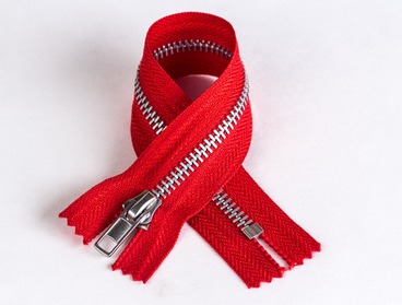 Red non-separating zipper with aluminum teeth.