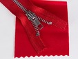7 inch red zipper shown on matching red faux leather. thumbnail image.