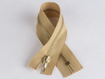 Non-separating 9 inch gold zipper with brass teeth.