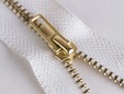 Non-separating 7 inch white zipper with brass teeth. thumbnail image.