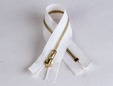 White zipper with brass - gold teeth. thumbnail image.