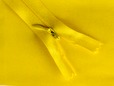 Yellow invisible zipper on matching yellow fabric. thumbnail image.