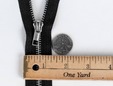 Black 18 inch silver colored teeth zipper. thumbnail image.