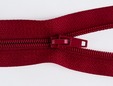 Macro shot of burgundy red separating zipper and nylon teeth. thumbnail image.