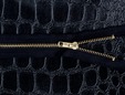 Black 7 inch zipper with gold colored teeth. thumbnail image.