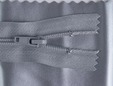 Grey zipper shown with matching vinyl fabric. thumbnail image.