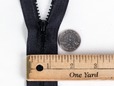 Black zipper with plastic teeth. thumbnail image.