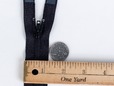Upclose shot of black 22 inch separating zipper. thumbnail image.