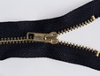 Black zipper with brass gold colored teeth. thumbnail image.
