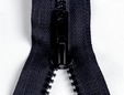 Upclose shot of black zipper with large plastic teeth. thumbnail image.