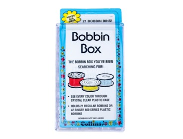 Clear plastic bobbin case.  Holds 21 regular size bobbins.