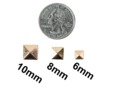 Different sizes of gold pyramid spikes. thumbnail image.