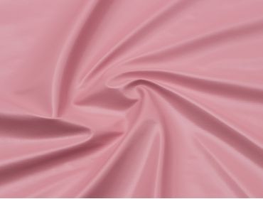 Baby pink four way stretch vinyl fabric.