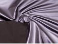 Black backing shown on top of metallic purple four-way stretch vinyl fabric. thumbnail image.