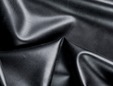 Unshined pearlsheen metallic black latex material. thumbnail image.